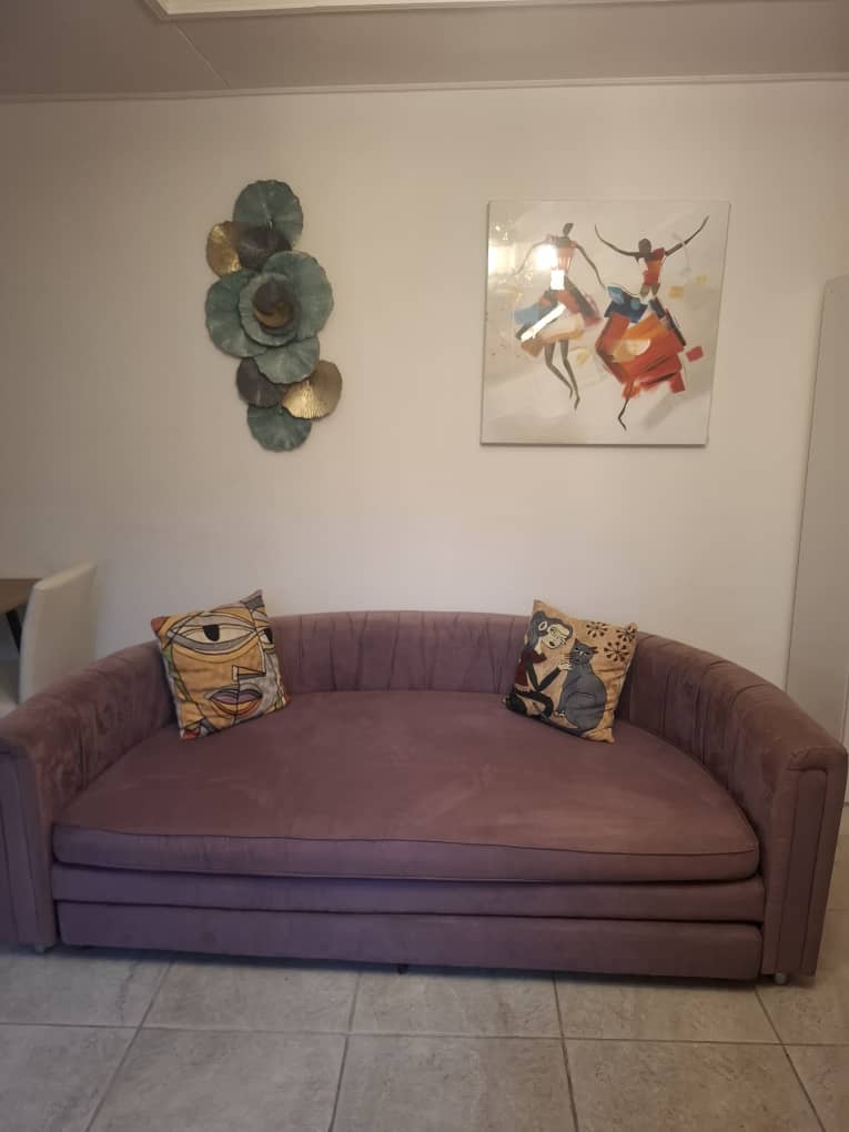 Suite CORAIL — Salon avec canapé mauve